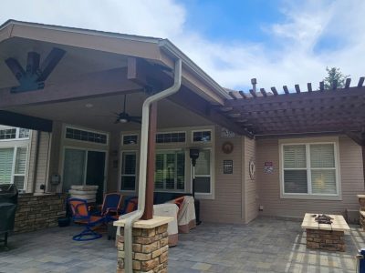 rear exterior of house with stained wooden pergola