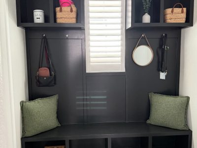 dark painted mudroom built-in shelves and bench
