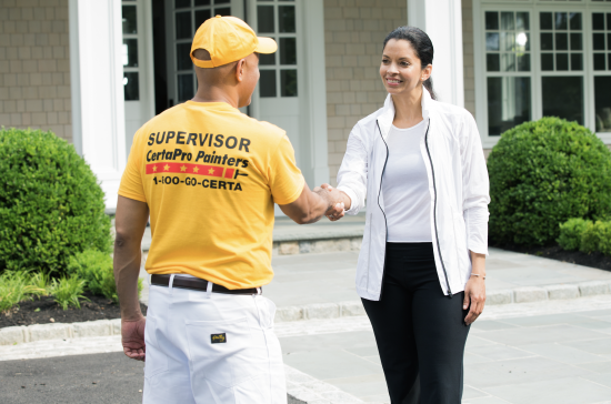 certapro painter worker and client shaking hands