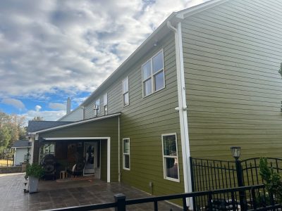 house exterior with green painted siding and white trim
