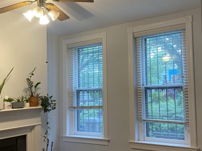 living room interior with fireplace and front windows