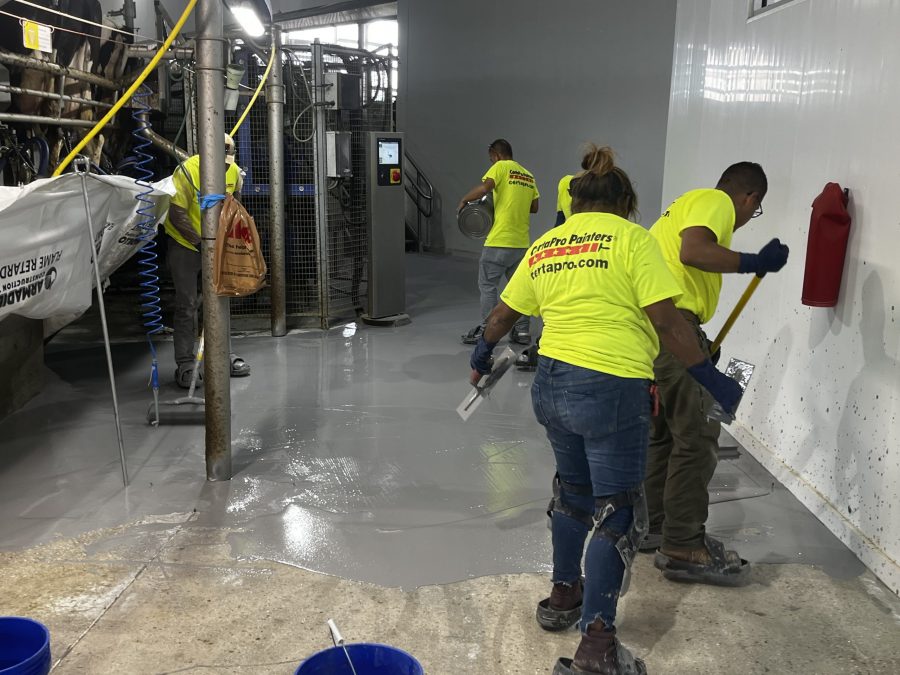McCarty Farms Commercial Flooring Project spreading out product onto floors Preview Image 13