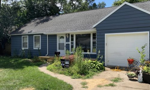 House with aluminum siding after being repainted.