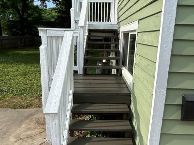 charcoal painted outdoor staircase with white railing