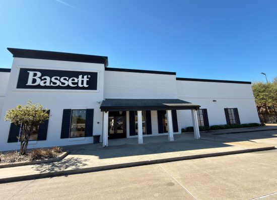 white painted retail building with black trim