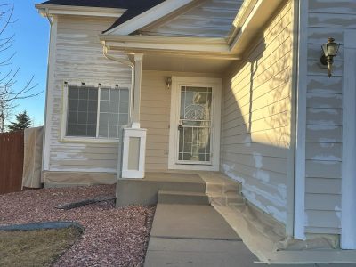house exterior with primer before repaint