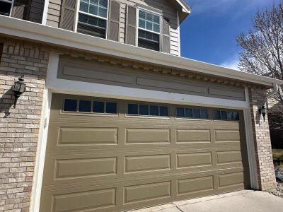 house exterior with painted garage and shutters