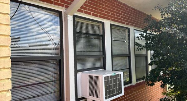 brick building exterior with painted window frames