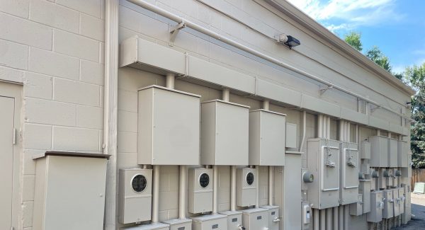 painted utility boxes on exterior wall