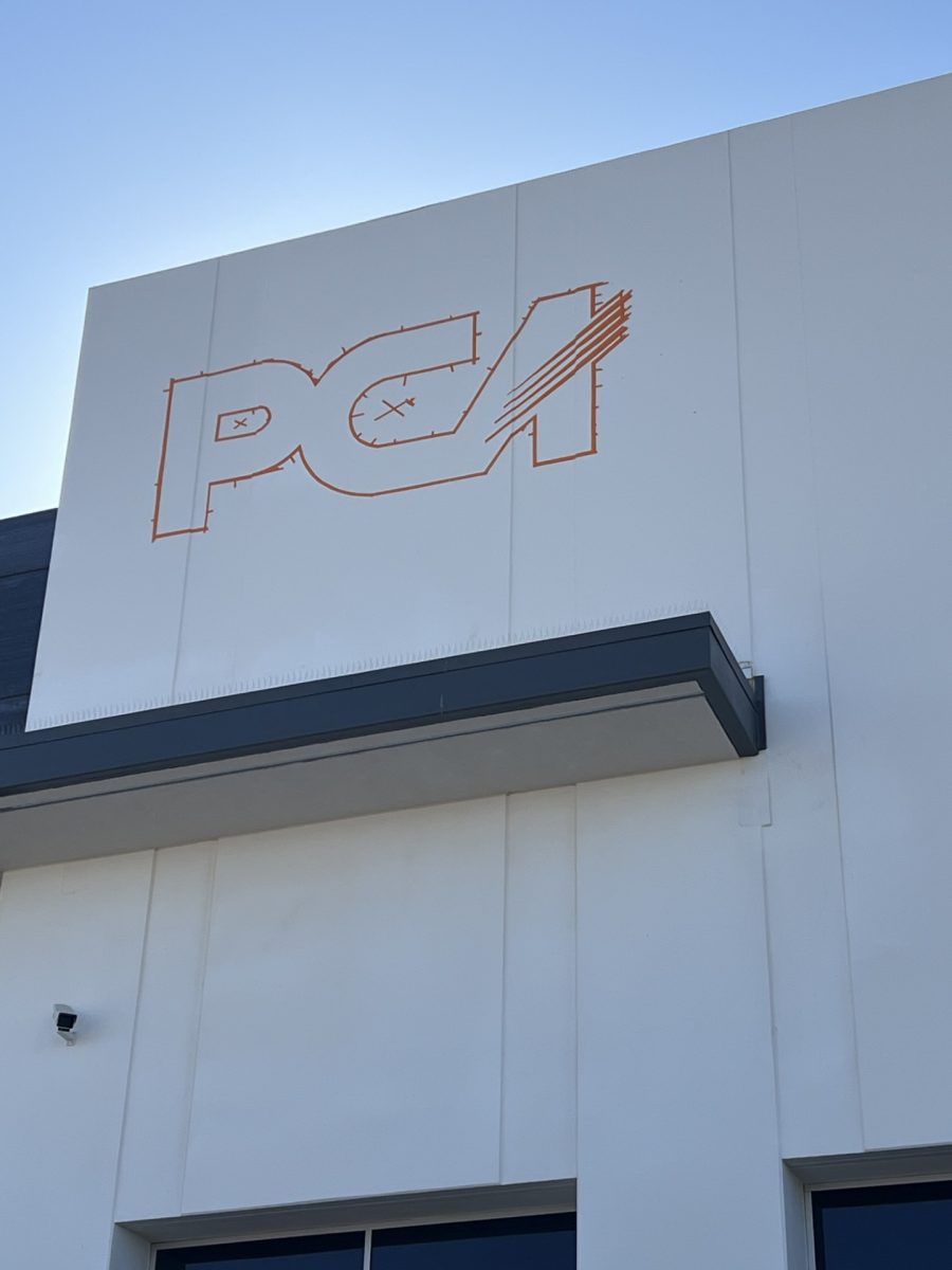 white and commercial building during logo painting project Preview Image 3