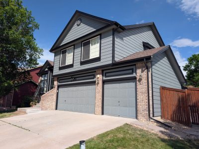 house exterior with blue paint and dark trim