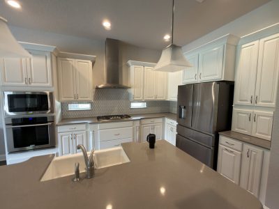 home kitchen interior with white painted cabinets