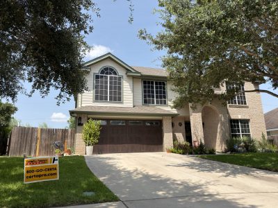 painted house exterior with green accent trim