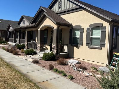front of home with painted stucco siding