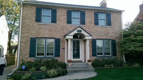 Black Shutter Repainted on Brick Home