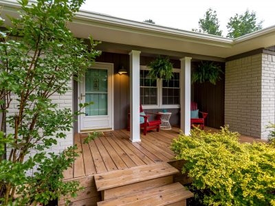 Historic Broadmoor home with freshly painted exterior body and trim and refreshed wood deck