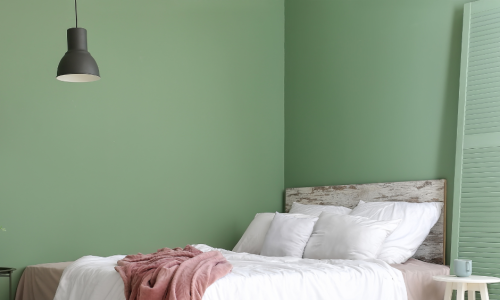green interior painting of a bedroom