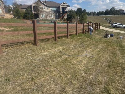 stained split rail fence surrounding CO property