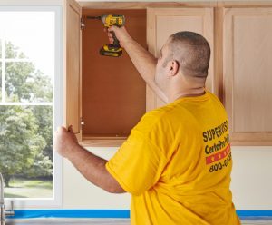 Painter Installing Fresh Cabinets in Delaware