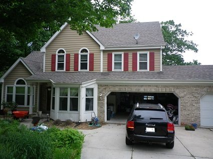 tan red and white painted home in brookfield wi