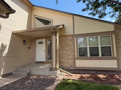 house exterior with beige siding and brown trim
