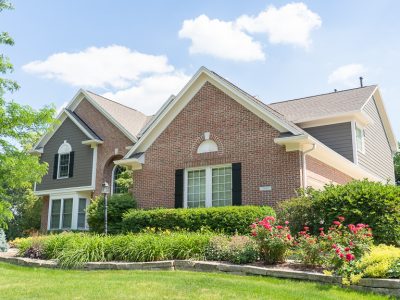 brick home with freshly painted trim and siding in carmel indiana