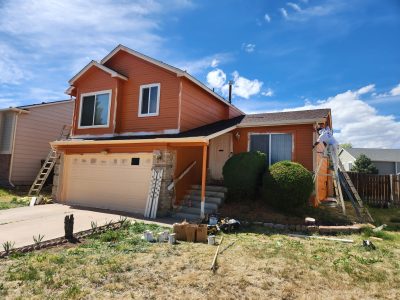 painters working on orange house udate